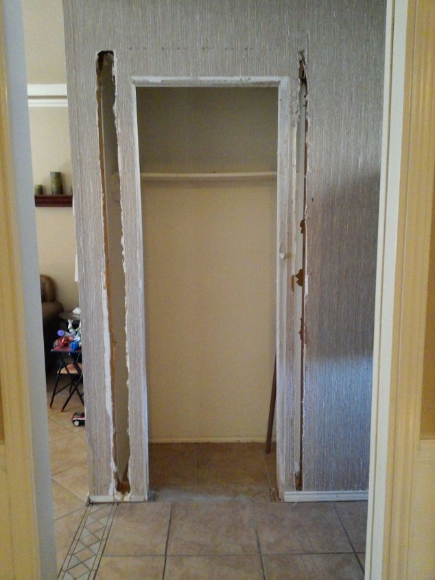 unused coat closet transformed into a welcoming mini mudroom
