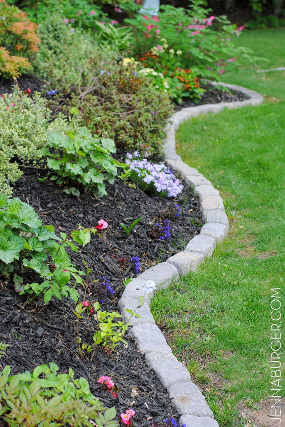 13 unique garden borders your neighbors will stop to admire, Line up a curvy row of trapezoid stones
