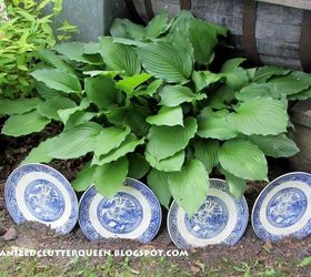 13 unique garden borders your neighbors will stop to admire, Stand a set of thrifted plates in the ground