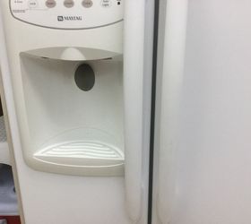 how do you clean the fridge s water ice dispenser