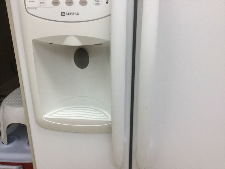 how do you clean the fridge s water ice dispenser