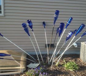 add color to your garden with bottles no bottle tree required, gardening, repurposing upcycling, Tall rods arranged in a group