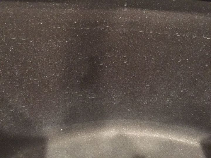 how can i clean paint off of my new black composite sink