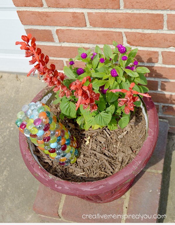 15 incredible backyard ideas using empty wine bottles, Craft a pretty plant nanny to water flowers