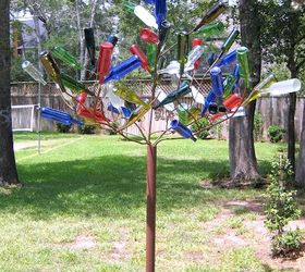 15 incredible backyard ideas using empty wine bottles, Make a bottle tree with stakes in the garden
