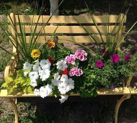 15 whimsical ways to use old furniture in your flower bed, Plant tall grasses in a mix of pretty blooms