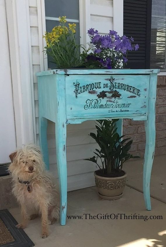 15 whimsical ways to use old furniture in your flower bed, Insert a planter inside an old sewing cabinet
