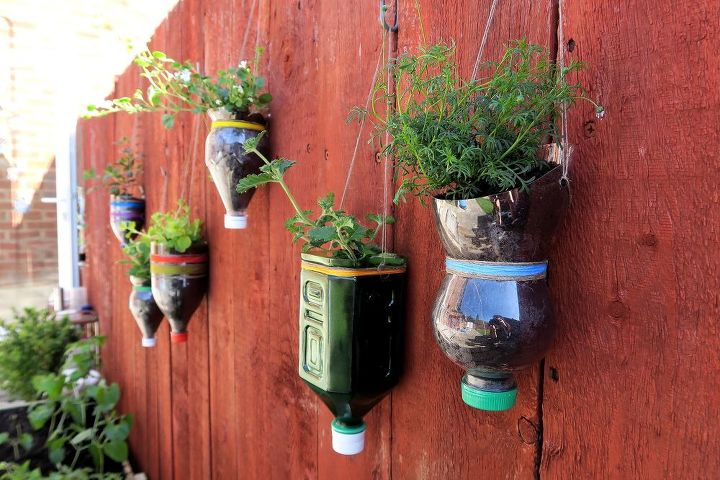 upcycled bottle planters, container gardening, gardening, repurposing upcycling, wall decor