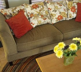 11 ways to make your beat up couch look brand new, Replace trashed cushions with throw pillows
