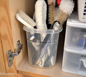 the 15 smartest storage hacks for under your sink, Store scrub brushes in a large plastic bucket