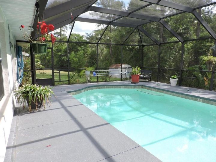 would it look right to put an outdoor kitchen under screened pool