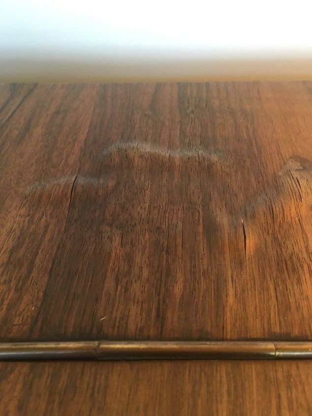water damage to top of wooden piano, Beside the bubbles the darkness is from water as well