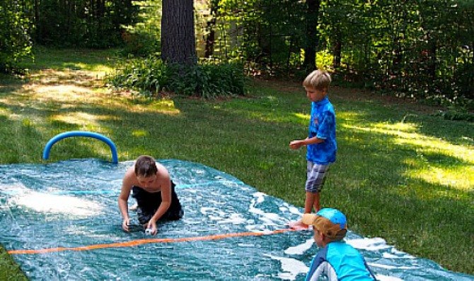 s 13 crazy fun yard games your family will flip for this summer, outdoor living, Lay down a DIY slip n slide for hockey games