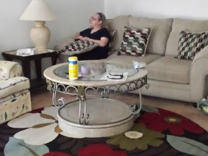 q how to brighten up the living room, home decor, home decor dilemma, just hung up the pics flowing rug taking from by the sliding doors which entrance door is near by noxt to the couch right stairs leads to upstairs