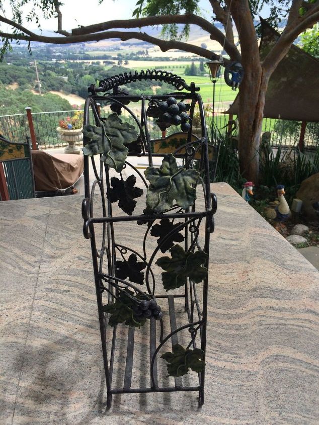 q any ideas on how i can upcycle this bottle holder for outside decor , gardening, home decor, repurpose household items, repurposing upcycling