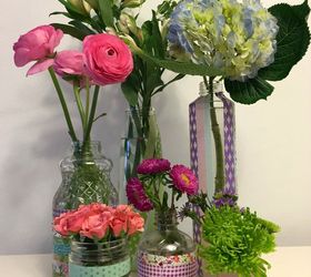 cut a piece of washi tape for these 25 creative ideas, Adhere pieces to jars for improvised vases