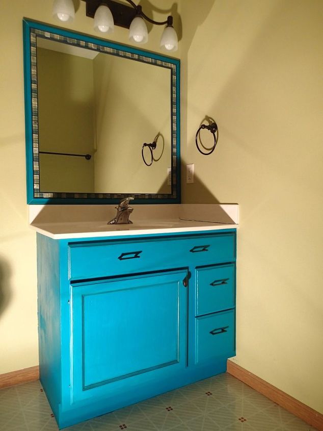 s 11 actually helpful tricks for decorating a small bathroom, bathroom ideas, Add tile borders to builder grade mirrors