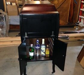 record player repurposed into a liquor cabinet