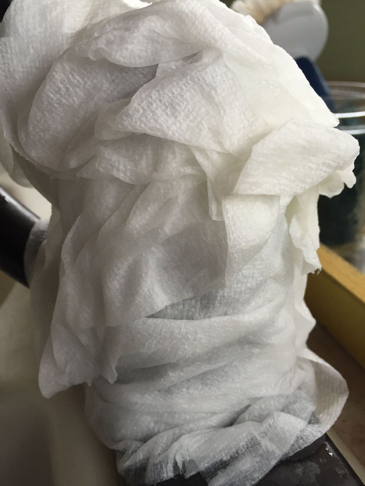 s 12 green cleaning tricks that will actually save you time money, cleaning tips, Wrap a crusty faucet in vinegar soaked towels