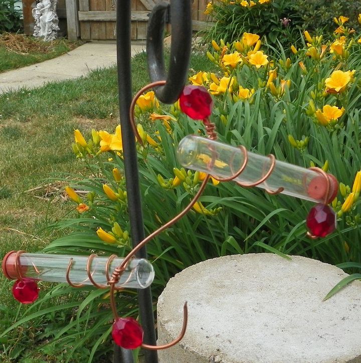 s 10 amazing ways to attract hummingbirds to your garden, gardening, pets animals, Hang test tubes upside down in the garden