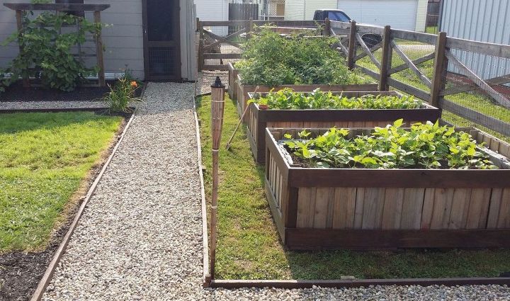 13 easiest ways to build a raised vegetable bed in your garden, Take apart pallets and line them end to end