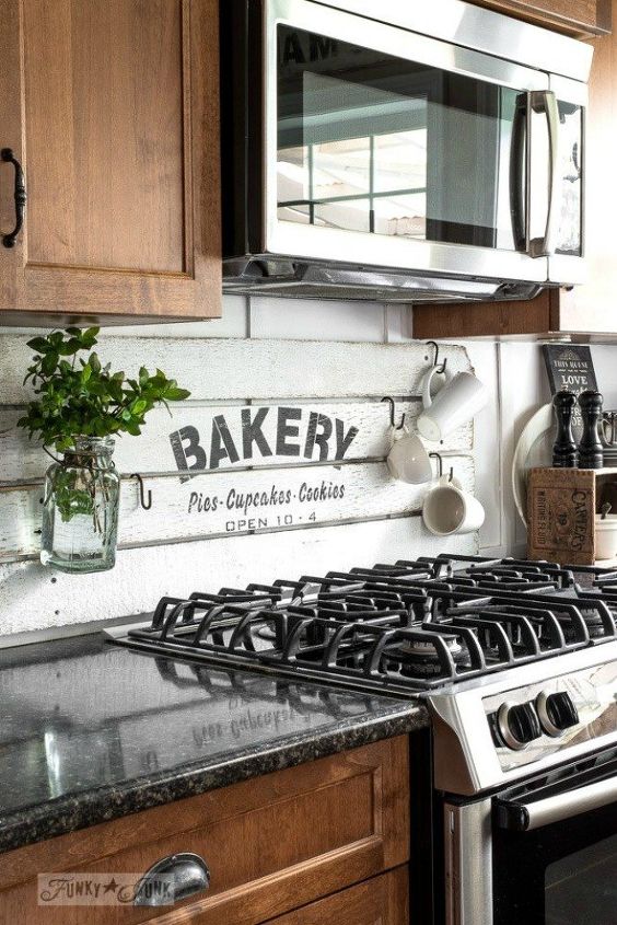 12 shiplap ideas that are hot right now, Fake a shiplap backsplash with a sign