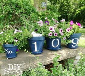 11 address sign ideas that ll make neighbors stop in admiration, Showcase them across a row of flower pots