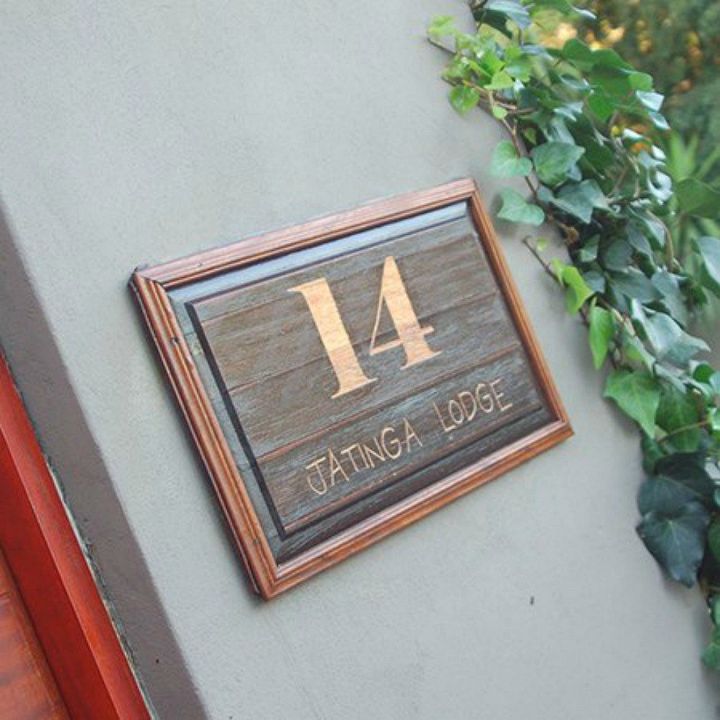 11 address sign ideas that ll make neighbors stop in admiration, Engrave it on an old door panel