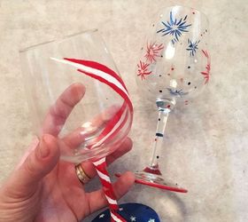 s 13 july 4th decorations that will blow your bbq guests away, crafts, outdoor living, seasonal holiday decor, Paint wine glasses with bursts of fireworks