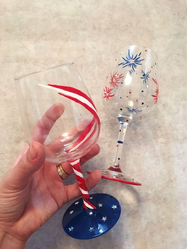 s 13 july 4th decorations that will blow your bbq guests away, crafts, outdoor living, seasonal holiday decor, Paint wine glasses with bursts of fireworks