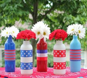 s 13 july 4th decorations that will blow your bbq guests away, crafts, outdoor living, seasonal holiday decor, Upcycle bottles into bursting flower displays