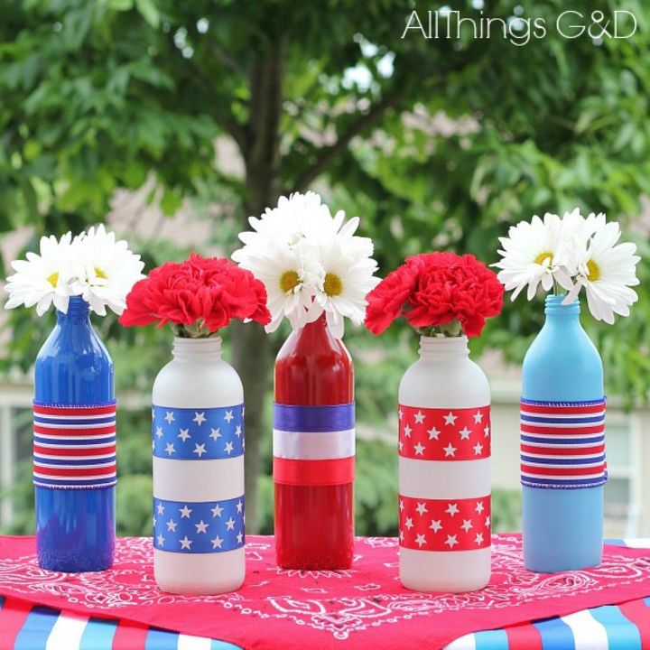 s 13 july 4th decorations that will blow your bbq guests away, crafts, outdoor living, seasonal holiday decor, Upcycle bottles into bursting flower displays