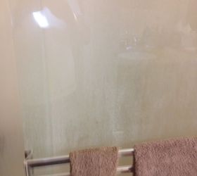 how do you clean hard water spots on shower doors