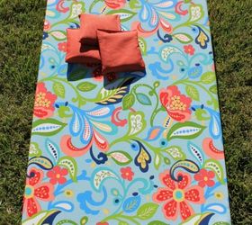 s 10 crazy fun ways to build a cornhole board this summer, outdoor living, woodworking projects, Give an Old Board a Bright Redo with Fabric