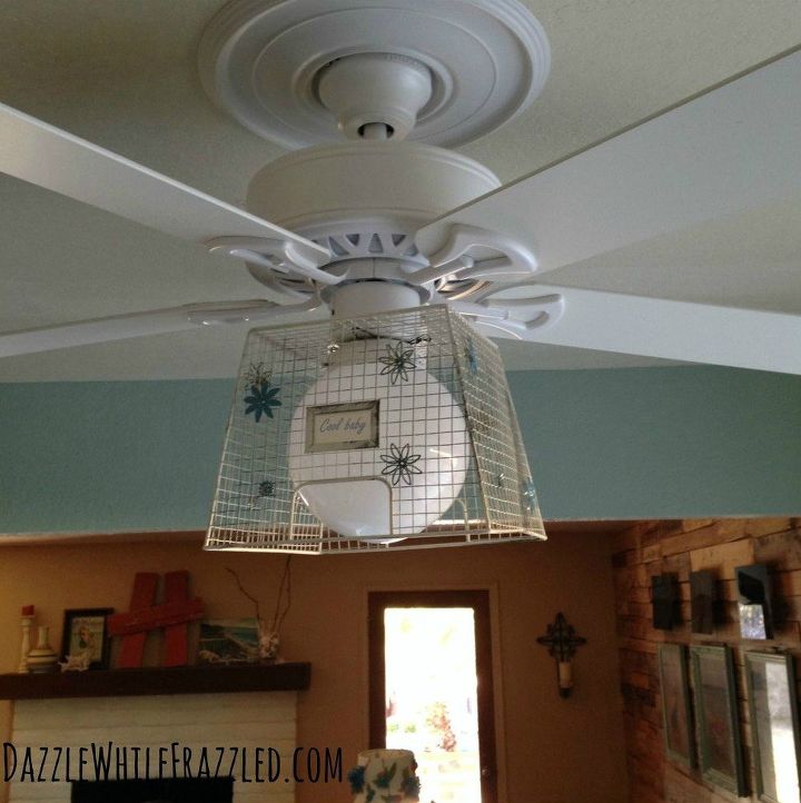 13 ways to upgrade your boring ceiling fan on a budget, Slide a wire basket over the light fixture