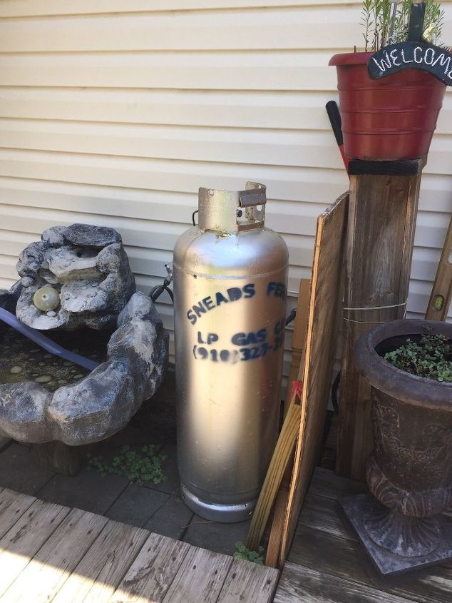 would like to build some kind of a screen to hide the propane tank, This is also a view of the propane tank next to my fountain with a piece of ply wood just sitting there