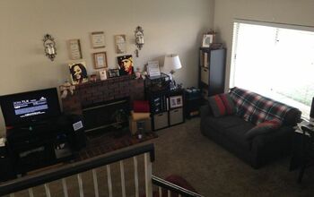 How can I make the stair railing behind my couch less of and eyesore?