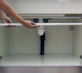 How sliding a tension rod under your kitchen sink will make your life so much easier