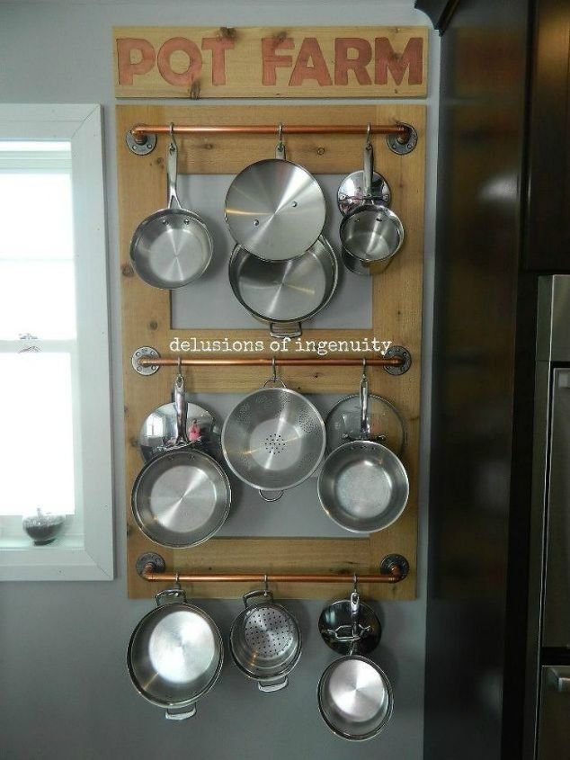 s 11 storage hacks that will instantly declutter your kitchen, kitchen design, organizing, storage ideas, Hang up your pots using crossbars and hooks