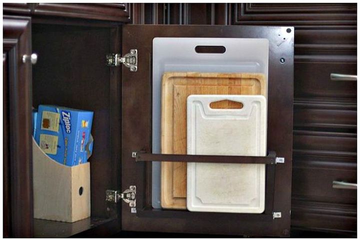 s 11 storage hacks that will instantly declutter your kitchen, kitchen design, organizing, storage ideas, Store cutting boards on your cabinet door