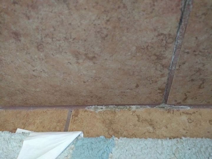 q whats this in the bathroom tile grout , bathroom ideas, cleaning tips, house cleaning, tiling