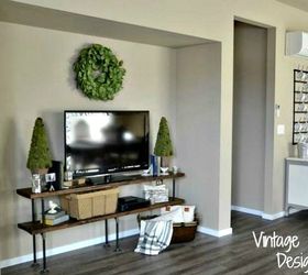 s why everyone is freaking out over these country cottage rooms, bedroom ideas, entertainment rec rooms, home decor, This vintage TV stand adds the perfect touch