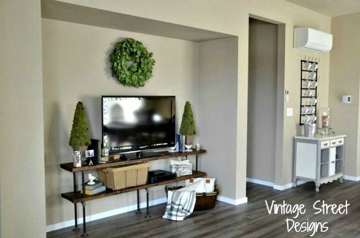 s why everyone is freaking out over these country cottage rooms, bedroom ideas, entertainment rec rooms, home decor, This vintage TV stand adds the perfect touch