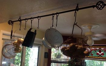 Make a Pot Rack Using a Drapery Rod.