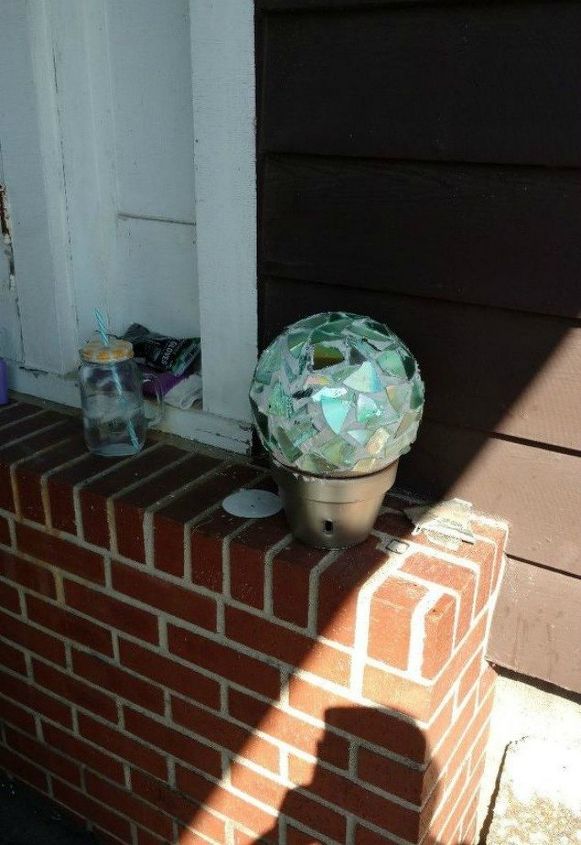 s 15 brilliant things to do with your old cds, repurposing upcycling, Use a broken one for sparkling garden decor