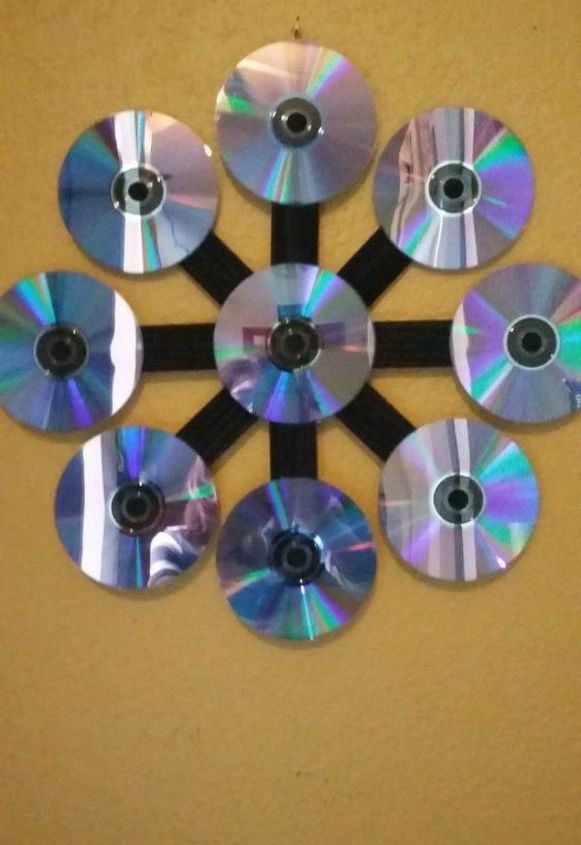 s 15 brilliant things to do with your old cds, repurposing upcycling, Add shiny decor to your wall