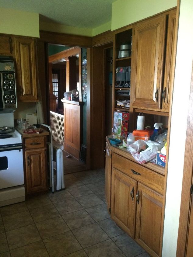 q my kitchen and i need your help can you give some very cheap ideas , countertops, kitchen cabinets, kitchen design, South and West walls swinging door to dining room and door to hallway in corner then the appliance garage on the West wall