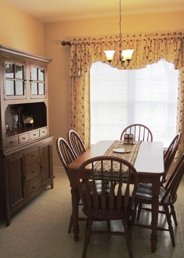 q should i paint or stain my kitchen cabinets, kitchen cabinets, kitchen design, painting, painting cabinets, The eat in dining area of my home s kitchen with an oak farmhouse table and oak china cabinet