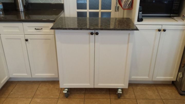 kitchen cabinet turned roll away cart moveable island