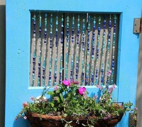 15 brilliant ways to upcycle old doors, Transform it into a colorful hanging planter
